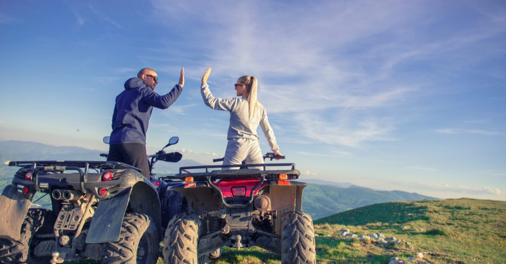 atv couple high fiving